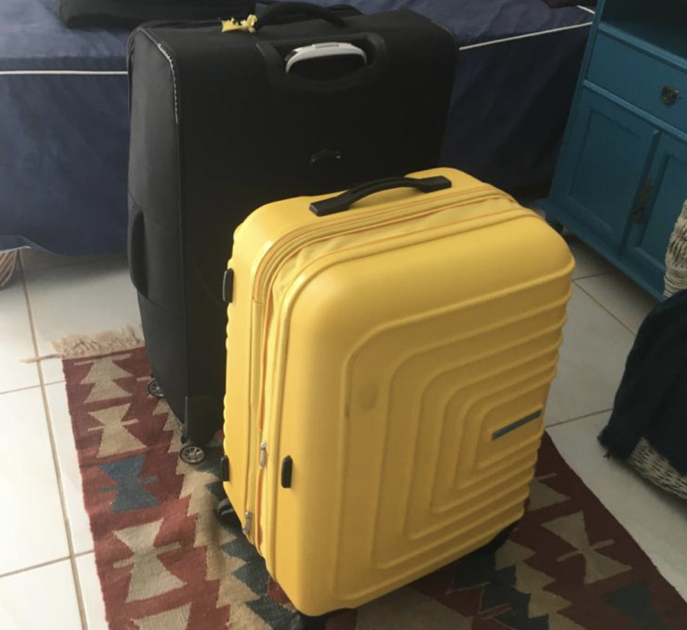 Big black suitcase and medium yellow suitcase