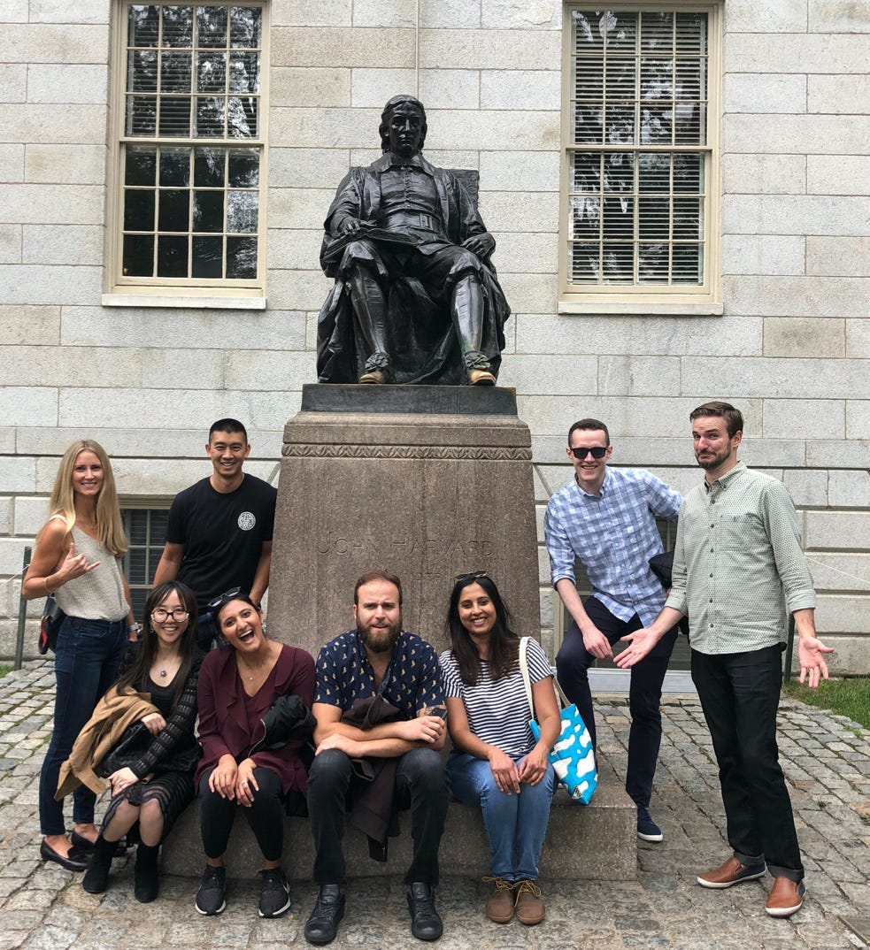 Madhavi and the Pear UX team on a trip to Boston, seen here at the famous statue of John Harvard.