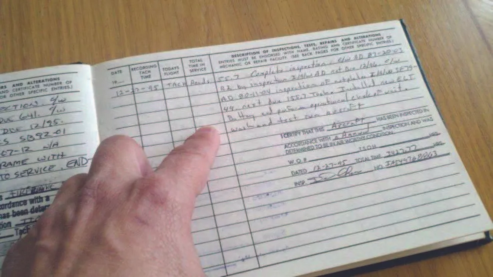 Photo of aircraft logbook.