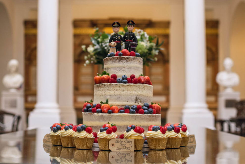 Luke and Dan’s cake had a topper with both of them in uniform. Image credit: HollyDerrickPhotography