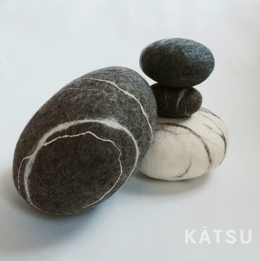 soft stone-like poufs by KATSU