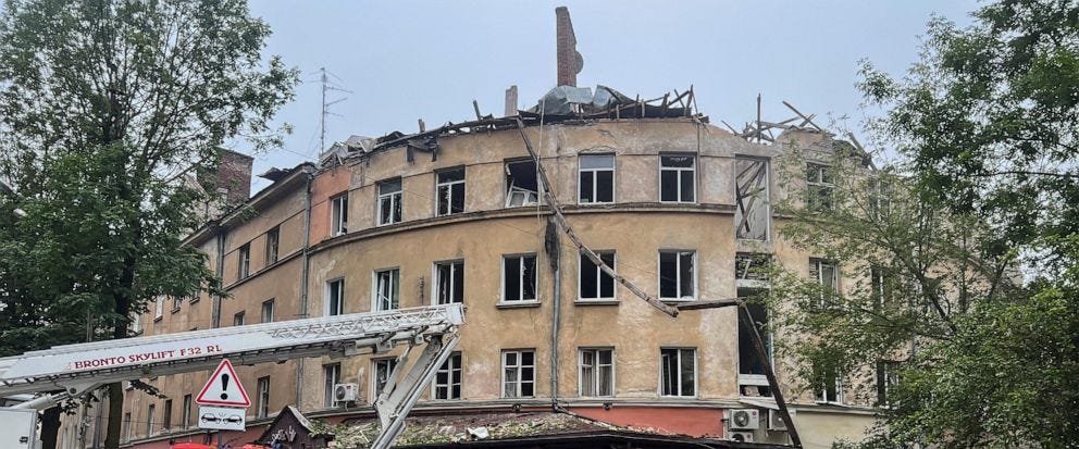 The image shows an apartment building in Lviv, Ukraine which is partially demolished as the result of a Russian cruise missile attack.