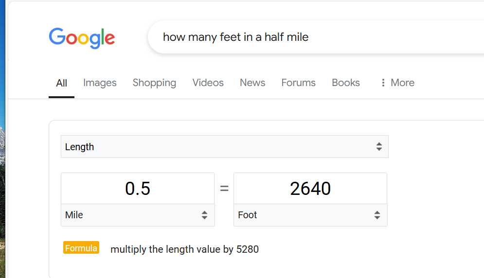 An image of a Google answer showing 2,640 feet for the question “How many feet in a half mile?”