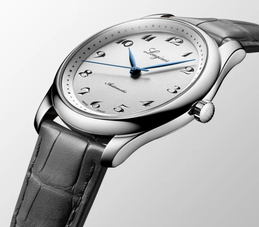 A classic luxury watch exudes an air of sophistication with its polished steel case, leather strap, and exquisite dial.