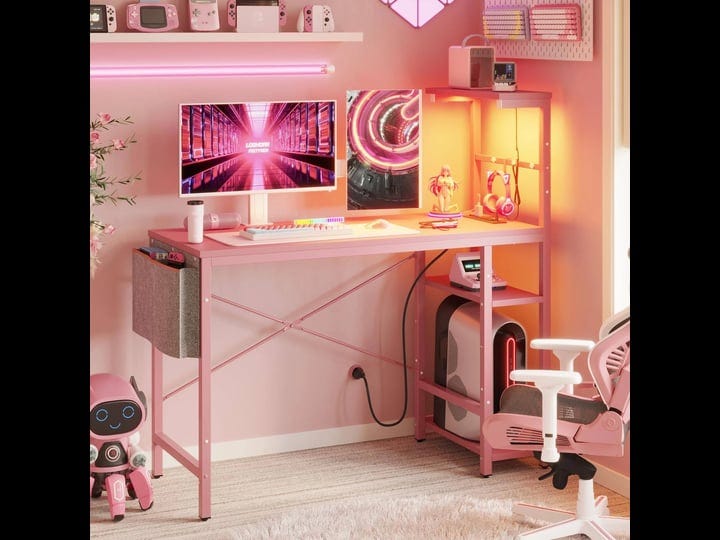 bestier-pink-gaming-desk-with-power-outlets-44-inch-led-gamer-desk-with-4-tiers-reversible-shelves-p-1