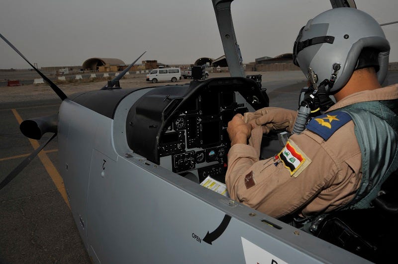 An Iraqi air force student pilot prepares for a training mission, Sept. 26, at Tikrit Air Base The pilots are learning to fly the T-6 Texan II and also become instructor pilots to train future Iraqi air force pilots. U.S. Air Force instructor pilots are training and advising the first group of Iraqi air force instructor pilots on the T-6A Texan II as part of the advise, train, assist and equip mission of Operation New Dawn. Once qualified the Iraqi air force pilots will become instructor pilots and continue to train the next generation of pilots.