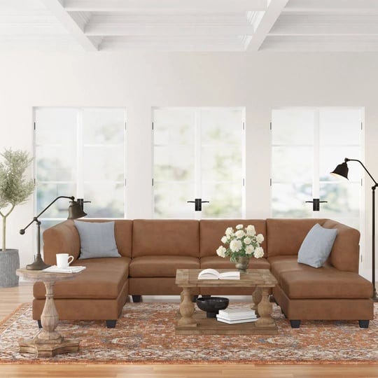 barnwell-120-wide-faux-leather-modular-corner-sectional-with-ottoman-three-posts-1