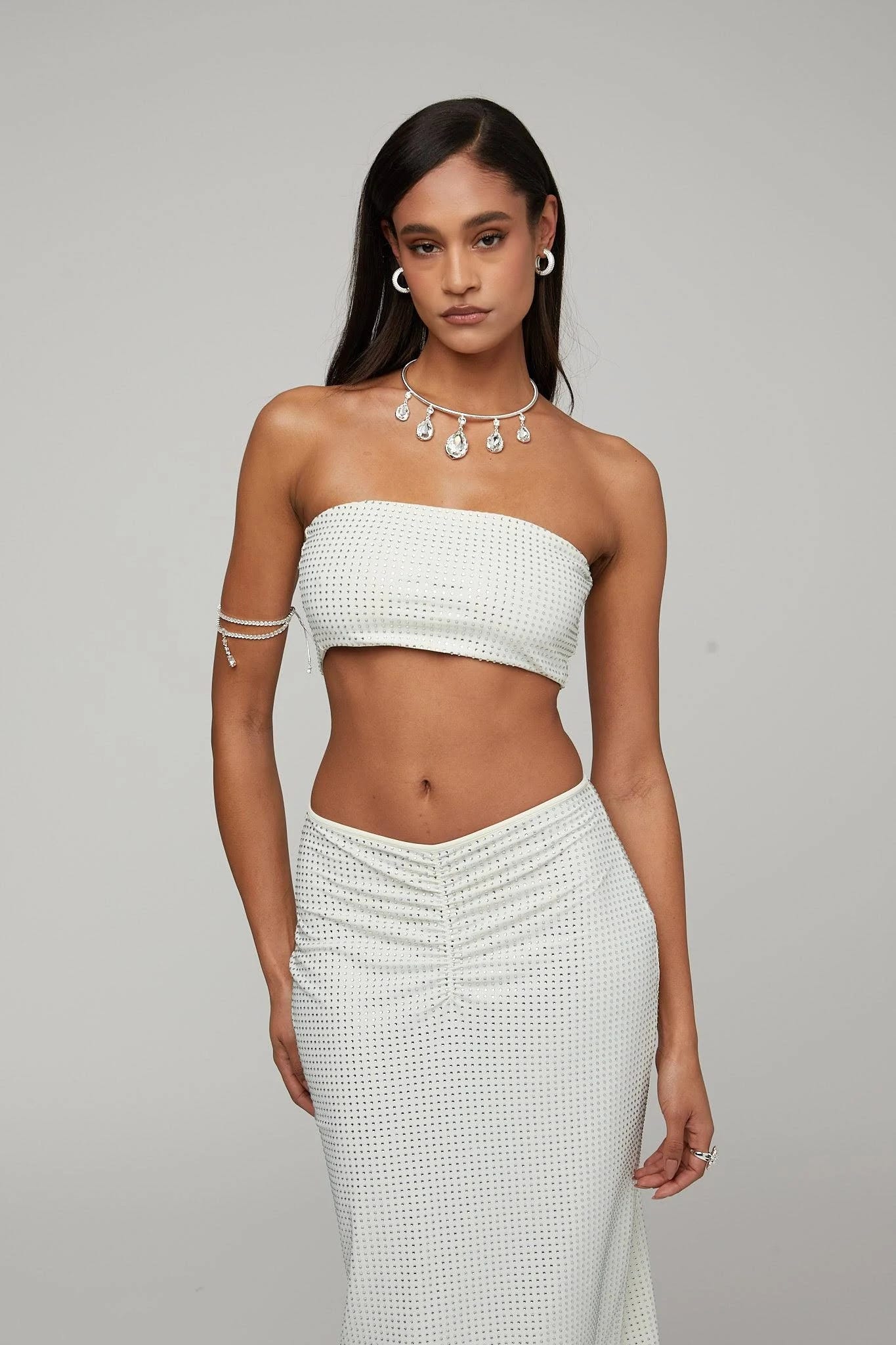 Stylish High-Waisted White Midi Crystal Skirt: Versatile and Comfortable | Image