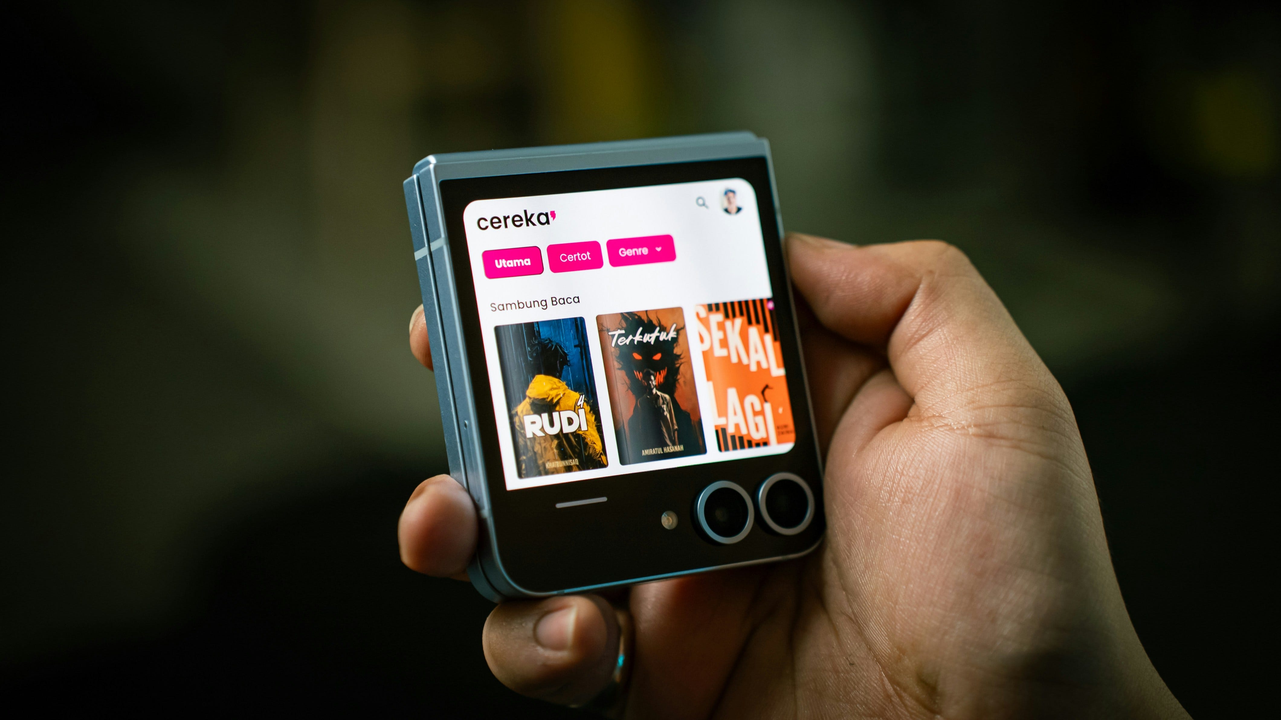 A person holding a smart phone in their hand