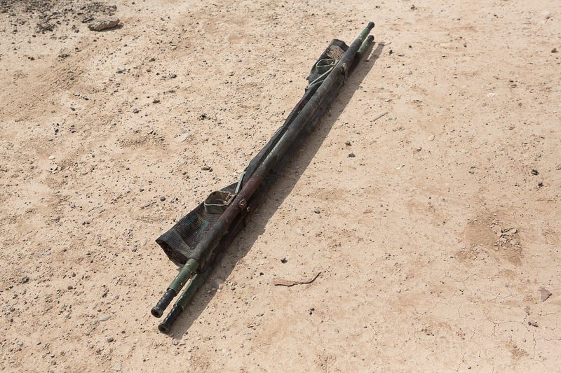 30/09/2015. Kirkuk, Iraq. A bloodied stretcher, used to carry a fatally wounded peshmerga fighter, lies in the dust near the village of Mansuriya. The fighter lost both legs after an Islamic State improvised explosive device was triggered during a large offensive to take several villages from militants west of of Kirkuk, Iraq. Supported by coalition airstrikes around 3500 peshmerga of the Patriotic Union of Kurdistan (PUK) and the Kurdistan Democratic Party (KDP) engaged in a large offensive to push Islamic State militants out of villages to the west of Kirkuk. During previous offensives ISIS fighters withdrew after sustained coalition air support, but this time in many places militants stayed and fought. The day would see the coalition conduct around 50 airstrikes helping the joint peshmerga force to advance to within a few kilometres of the ISIS stronghold of Hawija and re-take around 17 villages. Around 20 peshmerga lost their lives to improvised explosive devices left by the Islamic State, reports suggest that between 40 and 150 militants were killed.