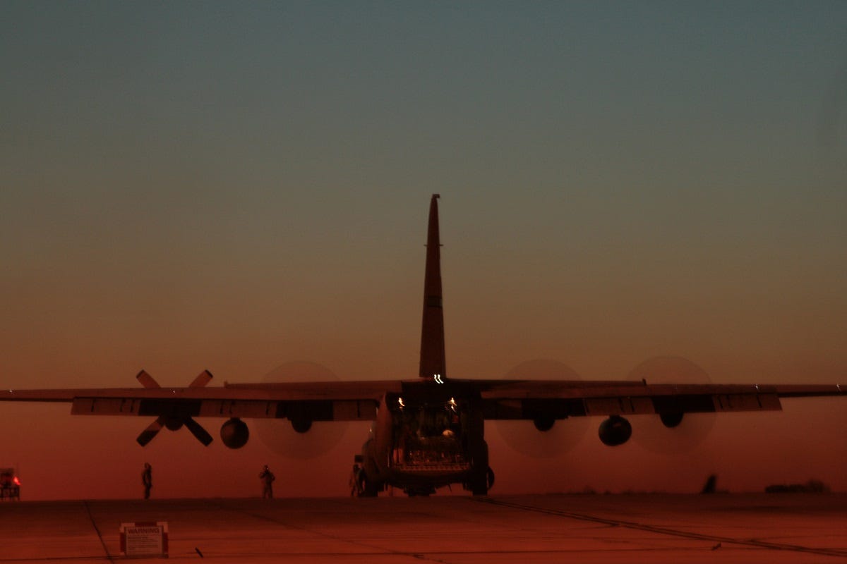 Flight crew members begin preflight routine and board a C-130 Hercules bound for a mission to Southwest Asia, Feb. 16, at Charlotte, N.C. The Airmen are assigned to the 145th Airlift Wing, North Carolina Air National Guard. The aircraft is capable of operating from rough, dirt strips and is the prime transport for air dropping troops and equipment into hostile areas. (U.S. Air Force photo/Tech. Sgt. Brian E. Christiansen)