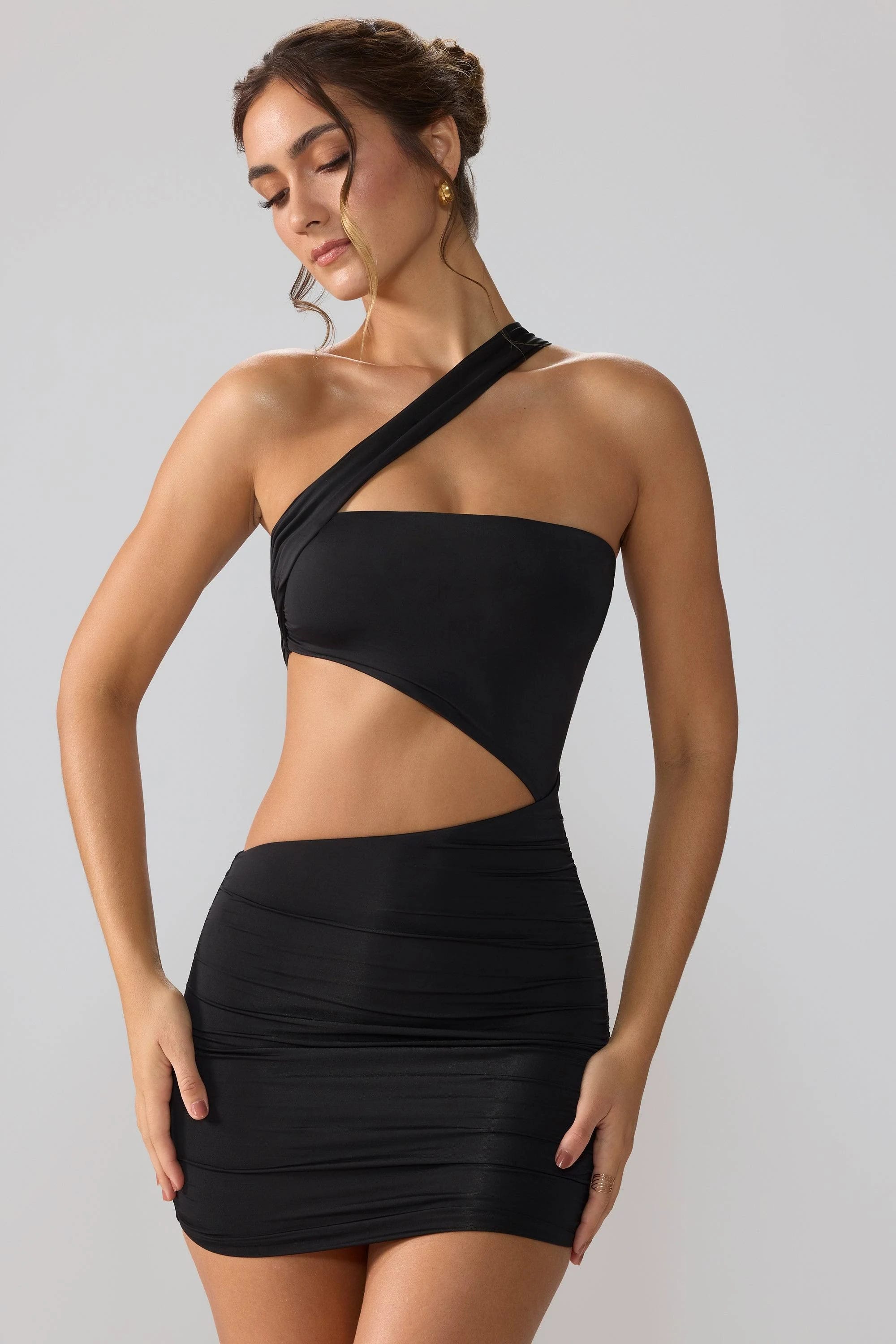 Bold, Ruched Black Mini Dress with Asymmetric Neckline | Image