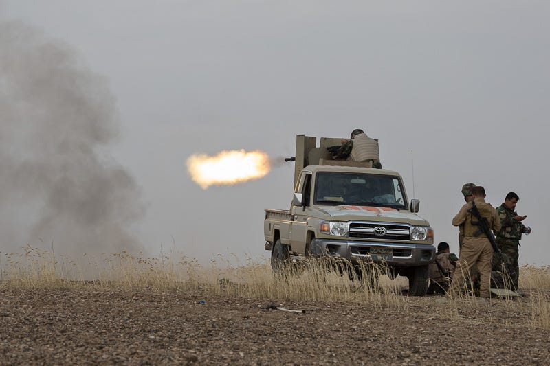 30/09/2015. Kirkuk, Iraq. A member of the KDP peshmerga fires a KPV 14.5mm heavy machine gun at ISIS positions in the village of Mansuriya, during a peshmerga offensive against Islamic State held villages west of Kirkuk, Iraq. Supported by coalition airstrikes around 3500 peshmerga of the Patriotic Union of Kurdistan (PUK) and the Kurdistan Democratic Party (KDP) engaged in a large offensive to push Islamic State militants out of villages to the west of Kirkuk. During previous offensives ISIS fighters withdrew after sustained coalition air support, but this time in many places militants stayed and fought. The day would see the coalition conduct around 50 airstrikes helping the joint peshmerga force to advance to within a few kilometres of the ISIS stronghold of Hawija and re-take around 17 villages. Around 20 peshmerga lost their lives to improvised explosive devices left by the Islamic State, reports suggest that between 40 and 150 militants were killed.