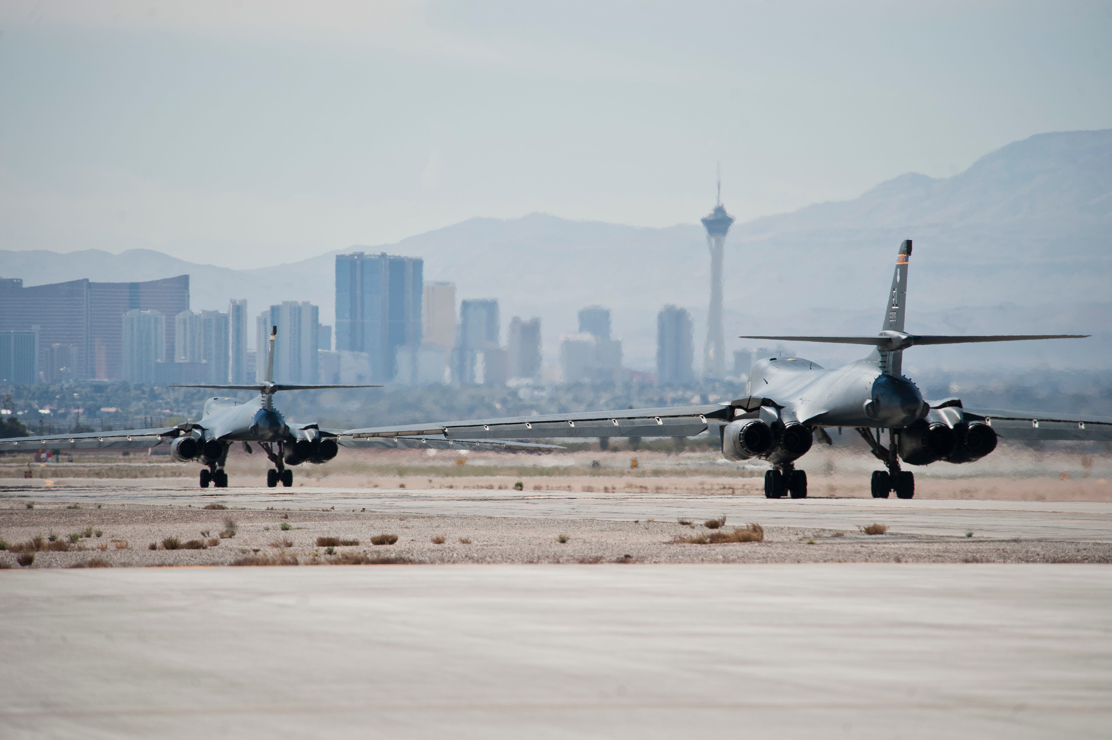 Two B-1B Lancers assigned to the 37th Bomb Squadron, Ellsworth Air Force Base, S.D., taxi during Red Flag 15-2 at Nellis AFB, Nev., March 10, 2015. Red Flag provides a series of intense air-to-air scenarios for aircrew and ground personnel to increase their combat readiness and effectiveness for future real-world operations. (U.S. Air Force photo by Staff Sgt. Siuta B. Ika)