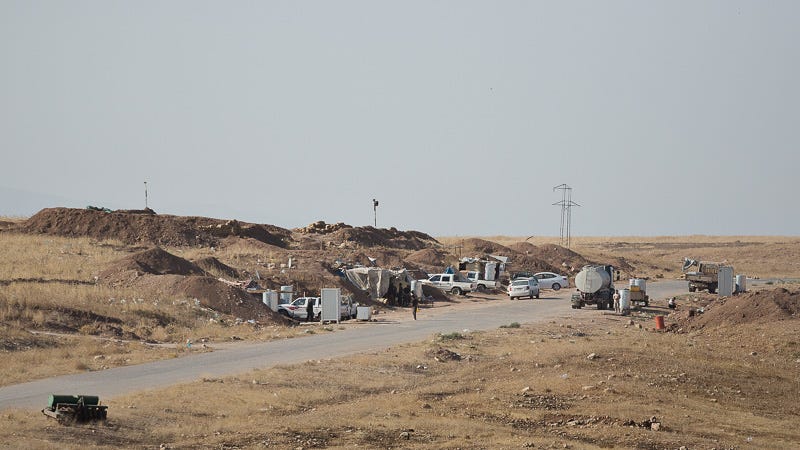 01/09/2015. Bashiqa, Iraq. A peshmerga position, set slightly back from the front line, on Bashiqa Mountain, Iraq. Bashiqa Mountain, towering over the town of the same name, is now a heavily fortified front line. Kurdish peshmerga, having withdrawn to the mountain after the August 2014 ISIS offensive, now watch over Islamic State held territory from their sandbagged high-ground positions. Regular exchanges of fire take place between the Kurds and the Islamic militants with the occupied Iraqi city of Mosul forming the backdrop. The town of Bashiqa, a formerly mixed town that had a population of Yazidi, Kurd, Arab and Shabak, now lies empty apart from insurgents. Along with several other urban sprawls the town forms one of the gateways to Iraq's second largest city that will need to be dealt with should the Kurds be called to advance on Mosul.