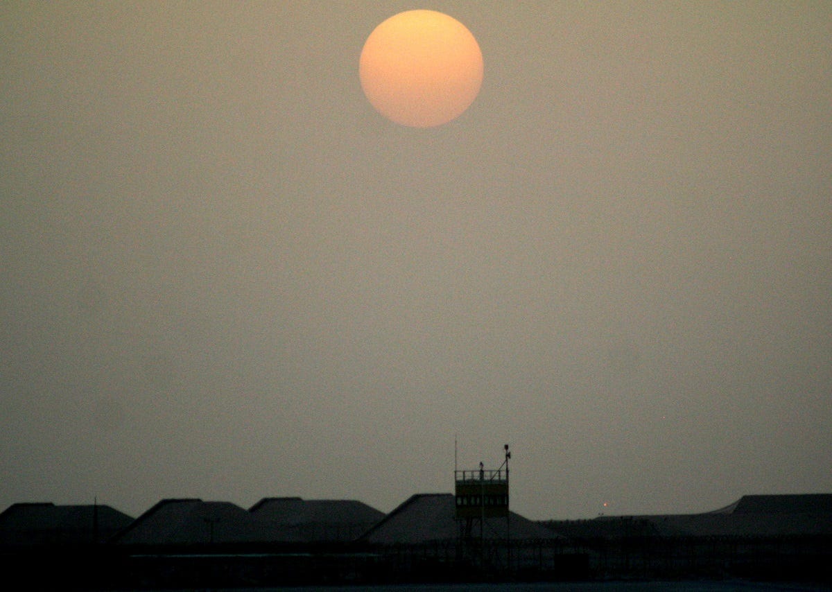 The sun sets over the operations area for the 379th Air Expeditionary Wing at a non-disclosed location in Southwest Asia, June 7, 2011. The 379th AEW supports operations New Dawn and Enduring Freedom and the Combined Joint Task Force-Horn of Africa.