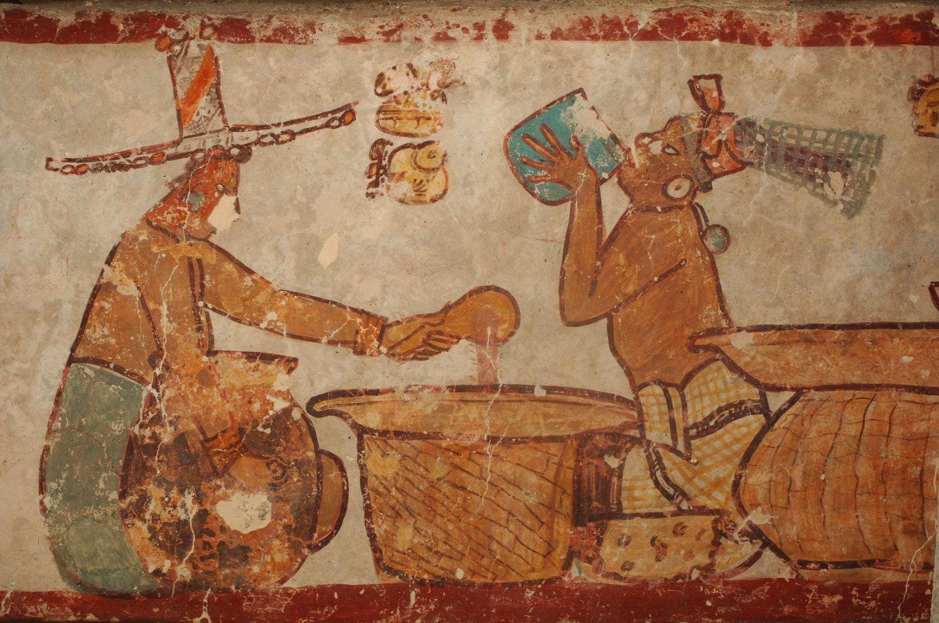 From the ancient Maya city of Calakmul depict the preparation and drinking of cacao.