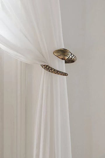 snake-curtain-tie-back-in-gold-at-urban-outfitters-1