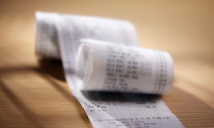 A large, partially rolled up receipt
