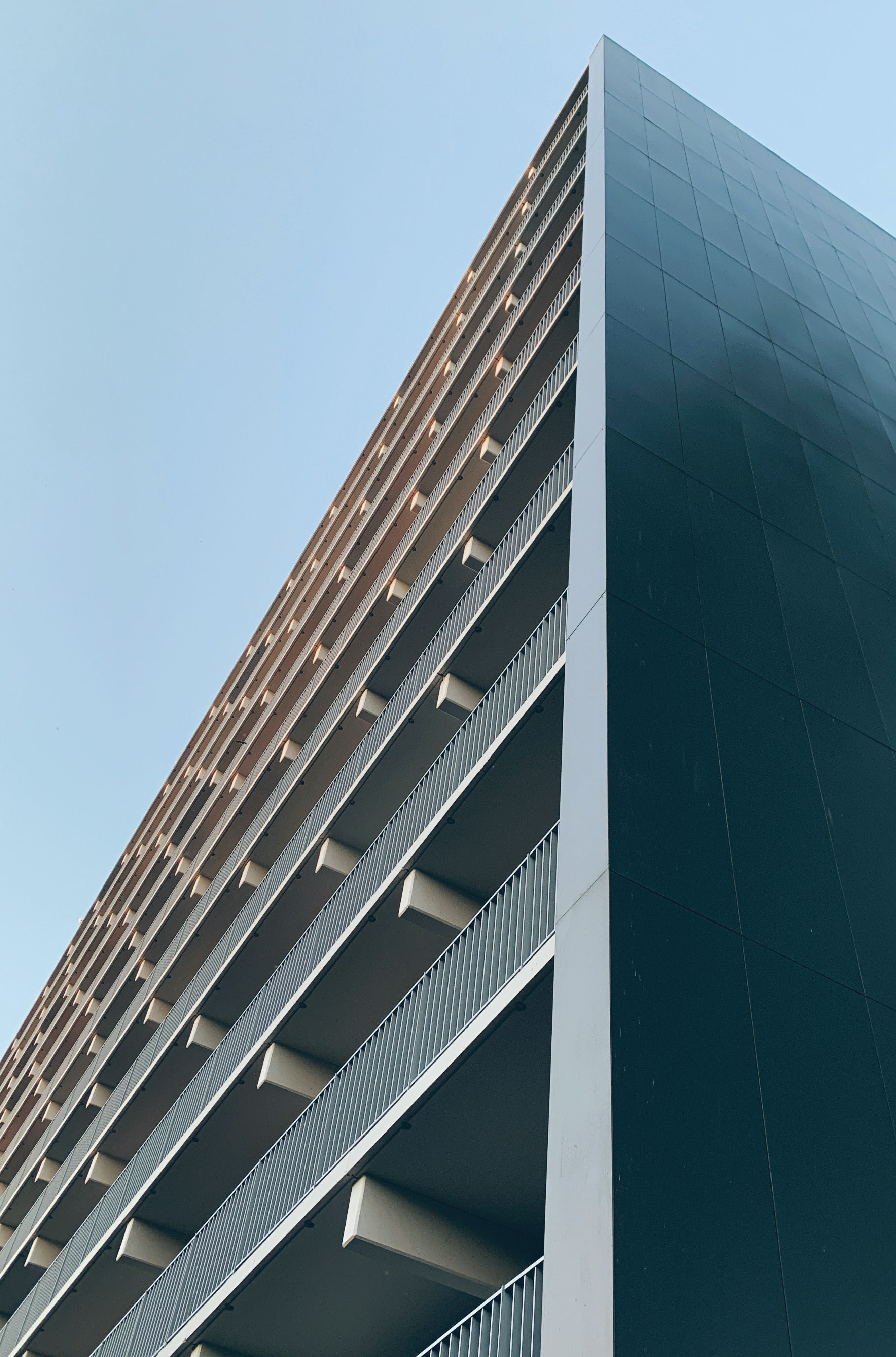 a tall building with balconies on top of it