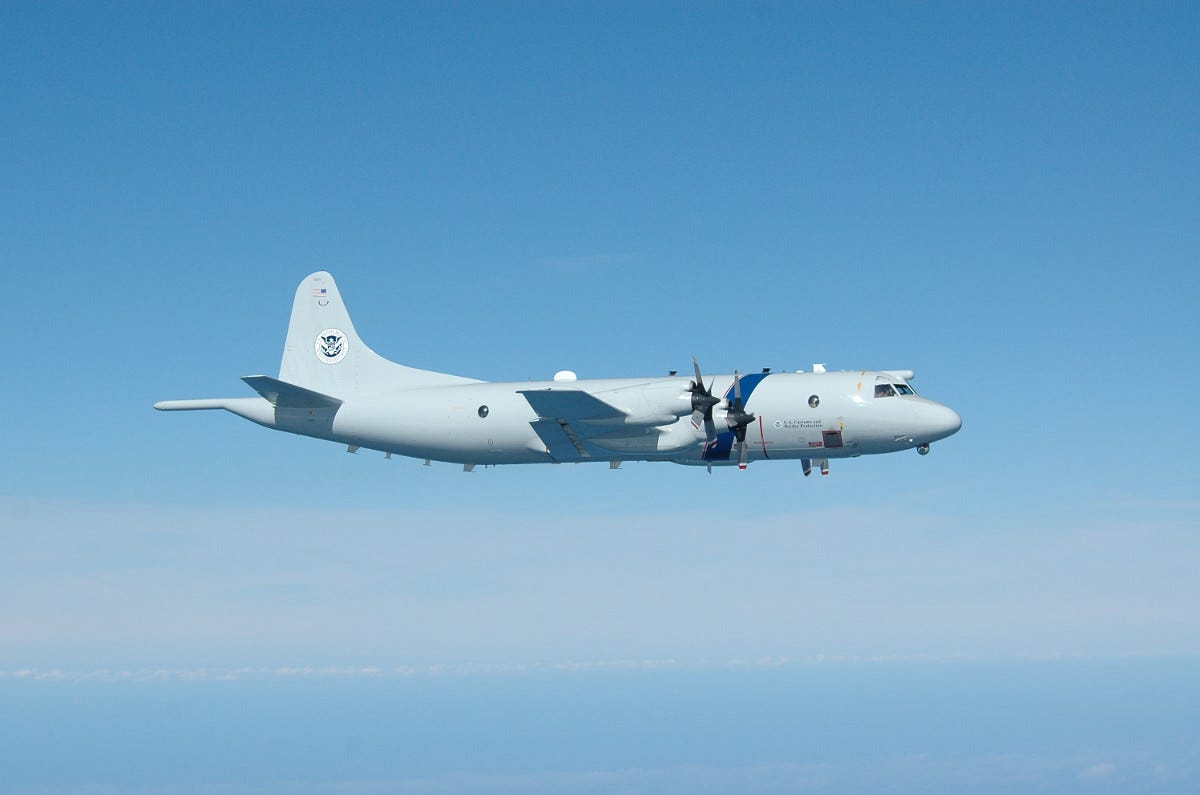 Above - a P-3 Long Range Tracker patrol plane. Customs and Border Protection photo. At top - Coast Guardsmen on top of the narco sub. Coast Guard capture.