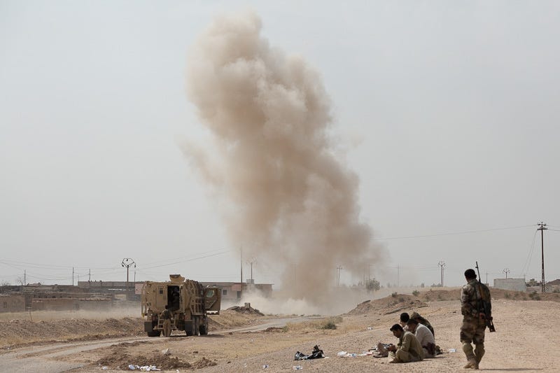 30/09/2015. Kirkuk, Iraq. Peshmerga engineers detonate an Islamic State laid improvised explosive device on a main road leading to the village of Mansuriya, west of Kirkuk, Iraq. Supported by coalition airstrikes around 3500 peshmerga of the Patriotic Union of Kurdistan (PUK) and the Kurdistan Democratic Party (KDP) engaged in a large offensive to push Islamic State militants out of villages to the west of Kirkuk. During previous offensives ISIS fighters withdrew after sustained coalition air support, but this time in many places militants stayed and fought. The day would see the coalition conduct around 50 airstrikes helping the joint peshmerga force to advance to within a few kilometres of the ISIS stronghold of Hawija and re-take around 17 villages. Around 20 peshmerga lost their lives to improvised explosive devices left by the Islamic State, reports suggest that between 40 and 150 militants were killed.