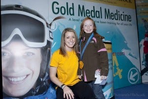 Hannah lets a young fan wear her 2010 gold medal