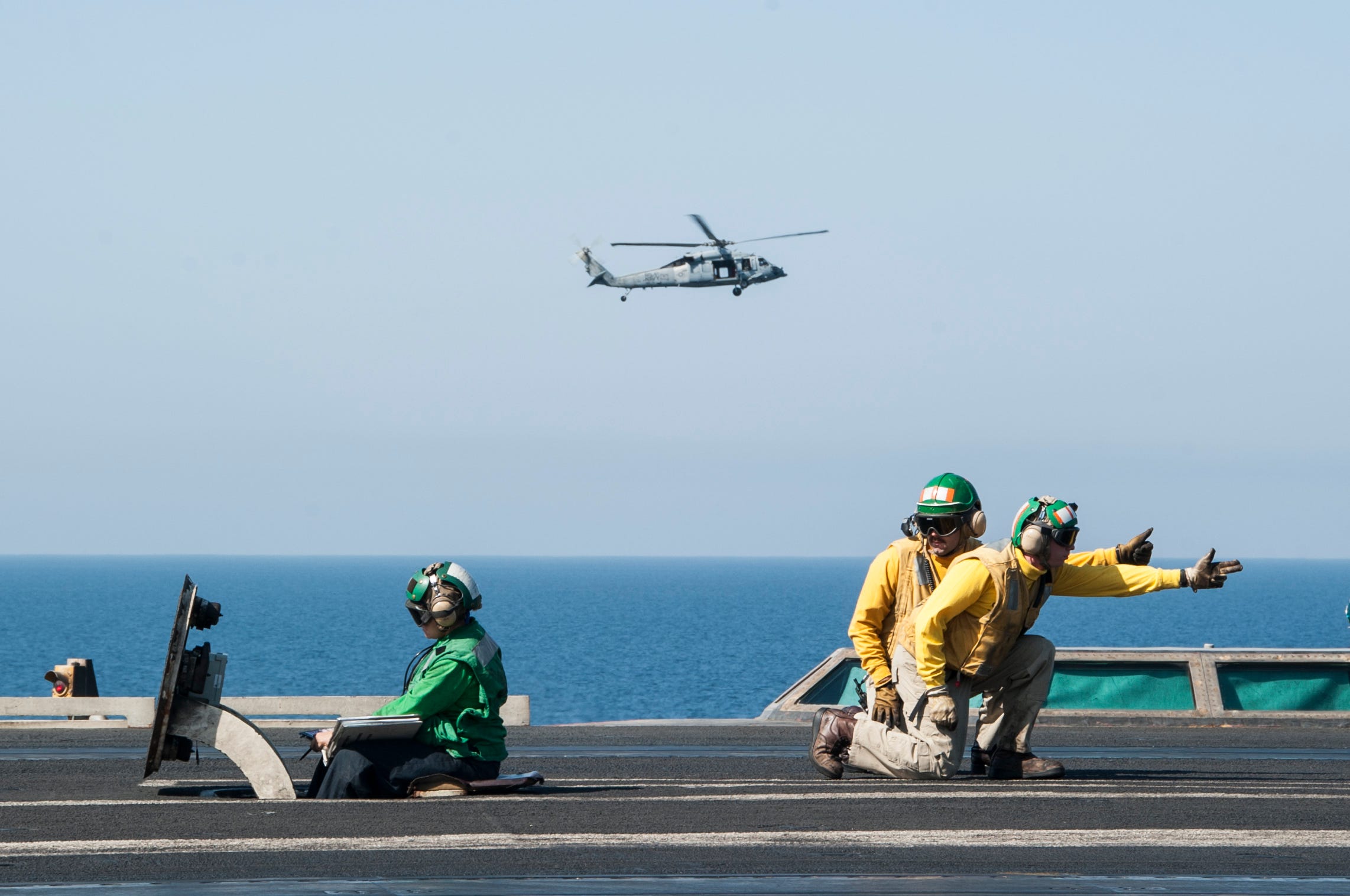 U.S. Sailors launch aircraft on the flight deck of the aircraft carrier USS George H.W. Bush (CVN 77) Oct. 10, 2014, in the Persian Gulf. The ship supported maritime security operations, strike operations in Iraq and Syria as directed, and theater security cooperation efforts in the U.S. 5th Fleet area of responsibility. President Barack Obama authorized humanitarian aid deliveries to Iraq as well as targeted airstrikes to protect U.S. personnel from extremists known as the Islamic State in Iraq and the Levant. U.S. Central Command directed the operations. (U.S. Navy photo by Mass Communication Specialist 3rd Class Brian Stephens/Released)