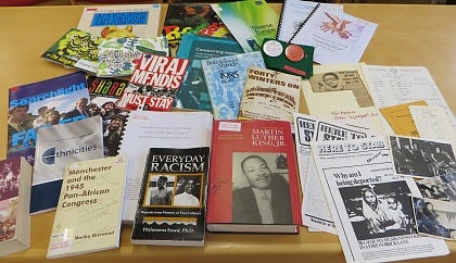 A selection of books, pamphlets and public information leaflets, relating to racism, Black History, political campaigns, and the experiences of Black, Asian, global majority, refugee and migrant communities.