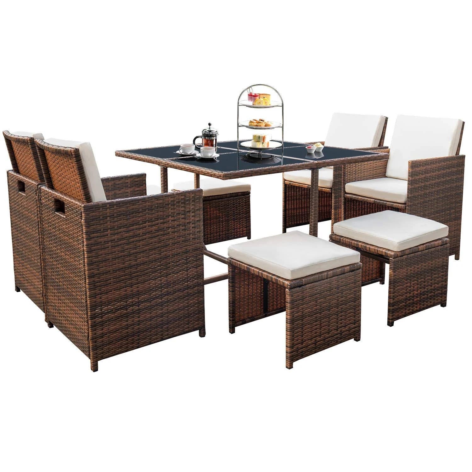 Chic Rattan Dining Set with Glass Table & Cushioned Seating | Image