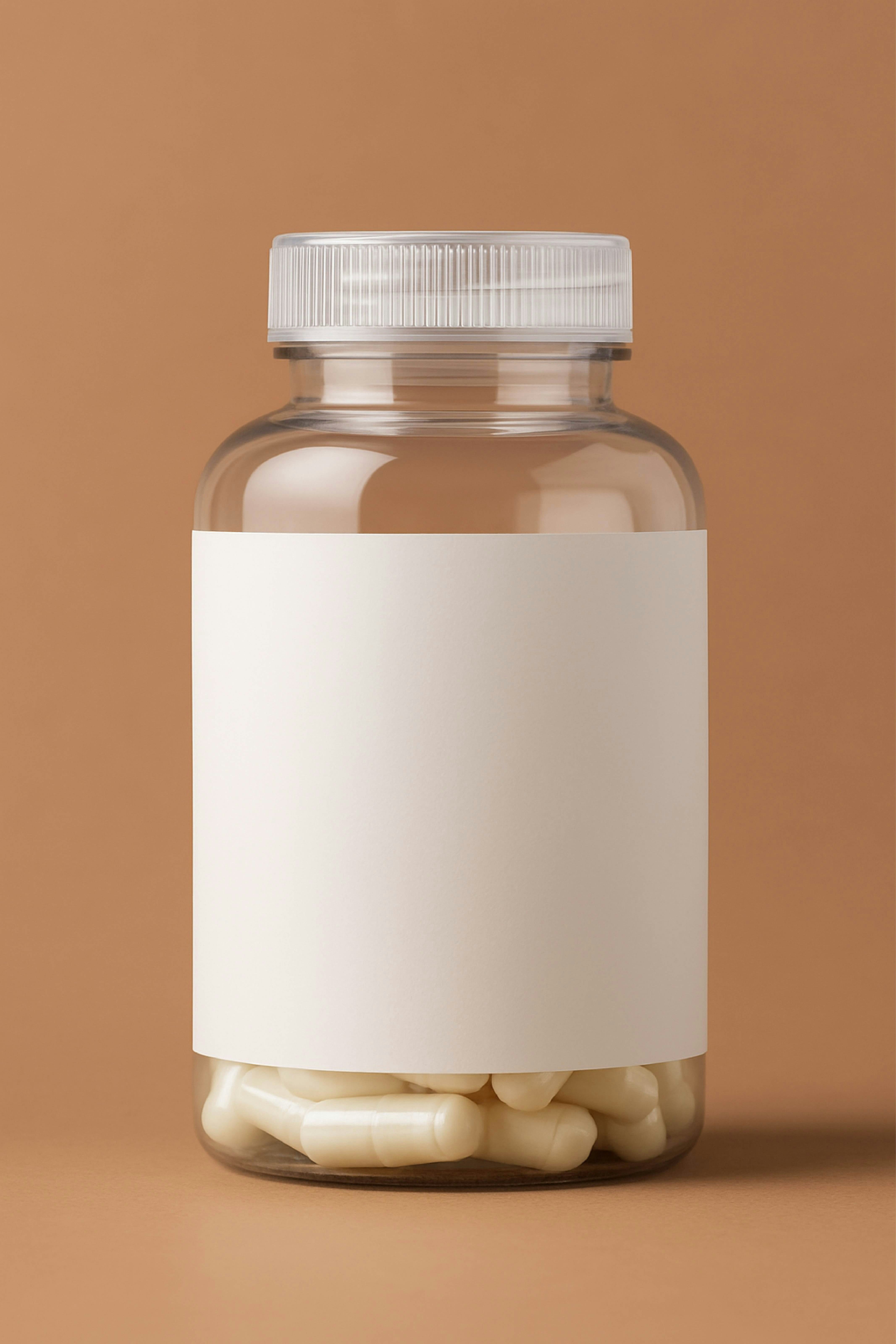 Clear bottle with white capsules and blank label