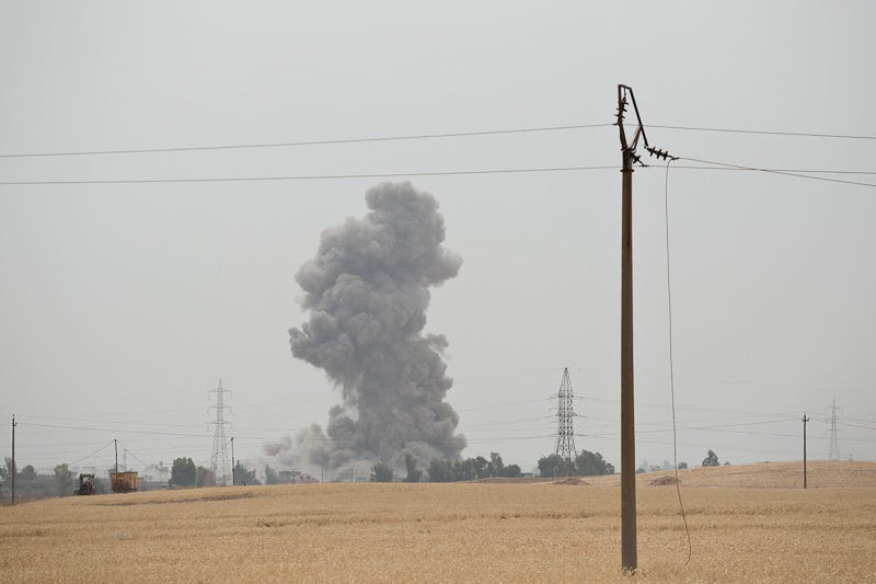 30/09/2015. Kirkuk, Iraq. A coalition forces airstrike hits and Islamic State position near the village of Mansuriya during an operation to clear militants from several villages to the west of Kirkuk, Iraq. Supported by coalition airstrikes around 3500 peshmerga of the Patriotic Union of Kurdistan (PUK) and the Kurdistan Democratic Party (KDP) engaged in a large offensive to push Islamic State militants out of villages to the west of Kirkuk. During previous offensives ISIS fighters withdrew after sustained coalition air support, but this time in many places militants stayed and fought. The day would see the coalition conduct around 50 airstrikes helping the joint peshmerga force to advance to within a few kilometres of the ISIS stronghold of Hawija and re-take around 17 villages. Around 20 peshmerga lost their lives to improvised explosive devices left by the Islamic State, reports suggest that between 40 and 150 militants were killed.