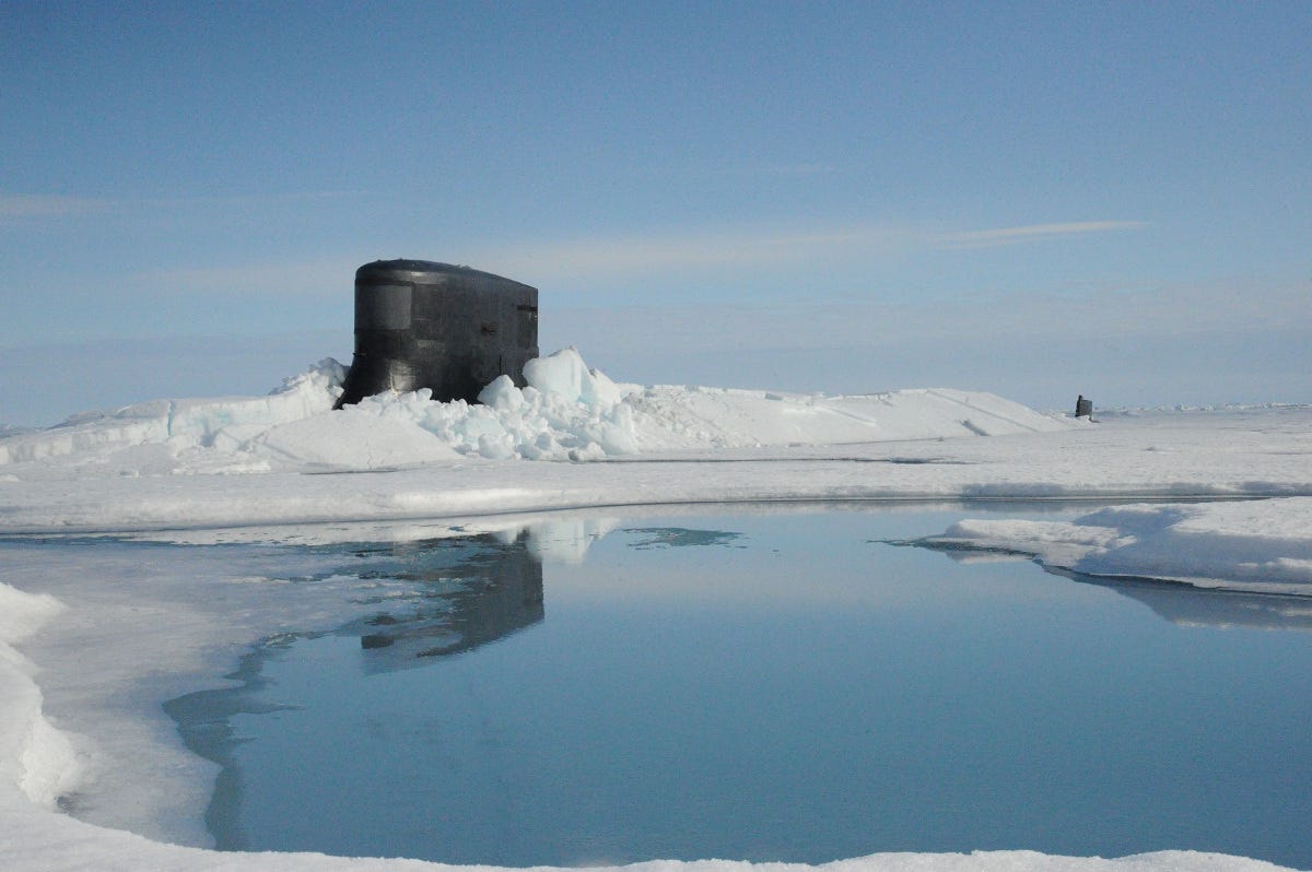 USS Seawolf's sail pokes out from under the Arctic ice. Navy photo