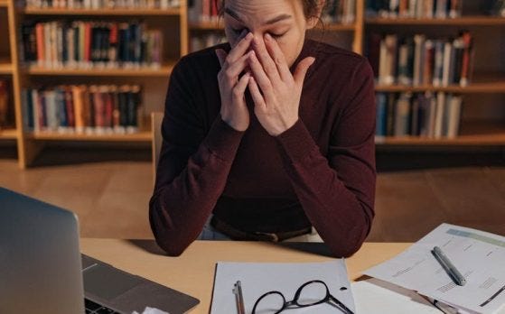 tired woman in the library