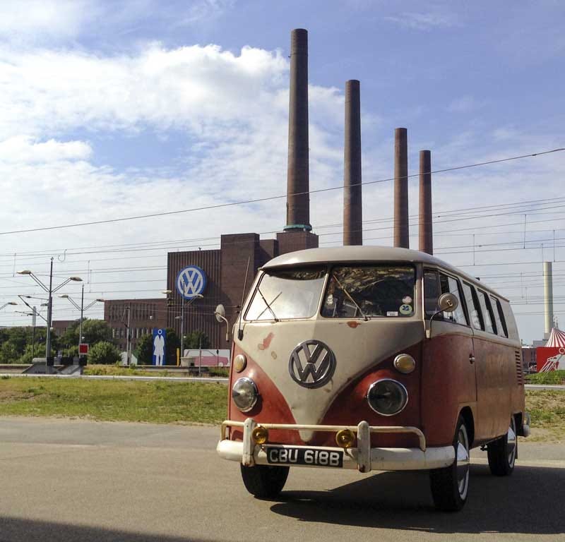 in front of the iconic VW Wolfsburg factory chimneys