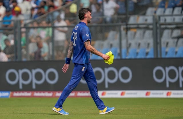 England’s Reece Topley walks off the field after breaking a finger against South Africa