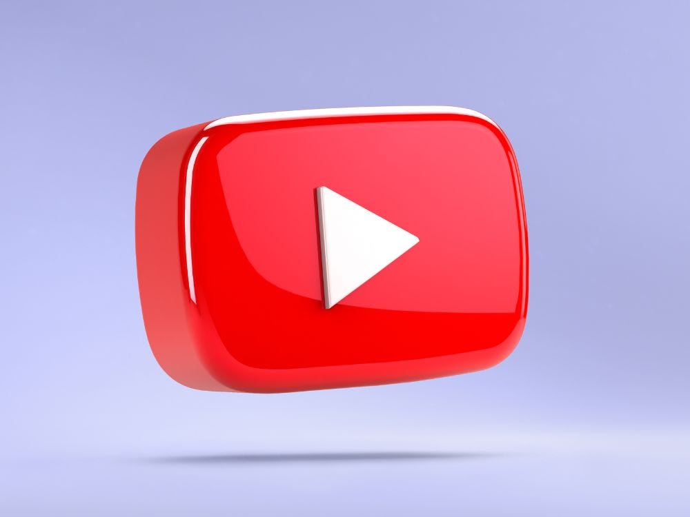 Youtube play button hovering in a light purple room, waiting to begin the video.