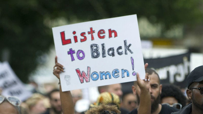 Sign saying ':isten to black women'