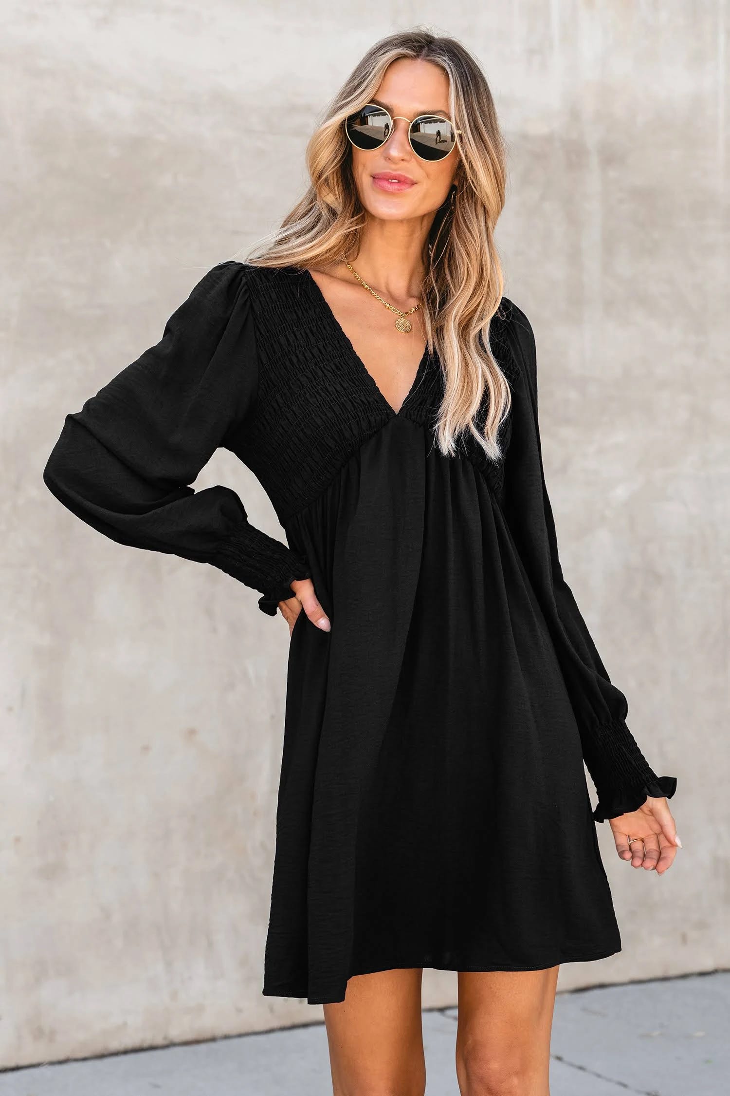 Sophisticated Black Smocked Mini Dress for Summer | Image