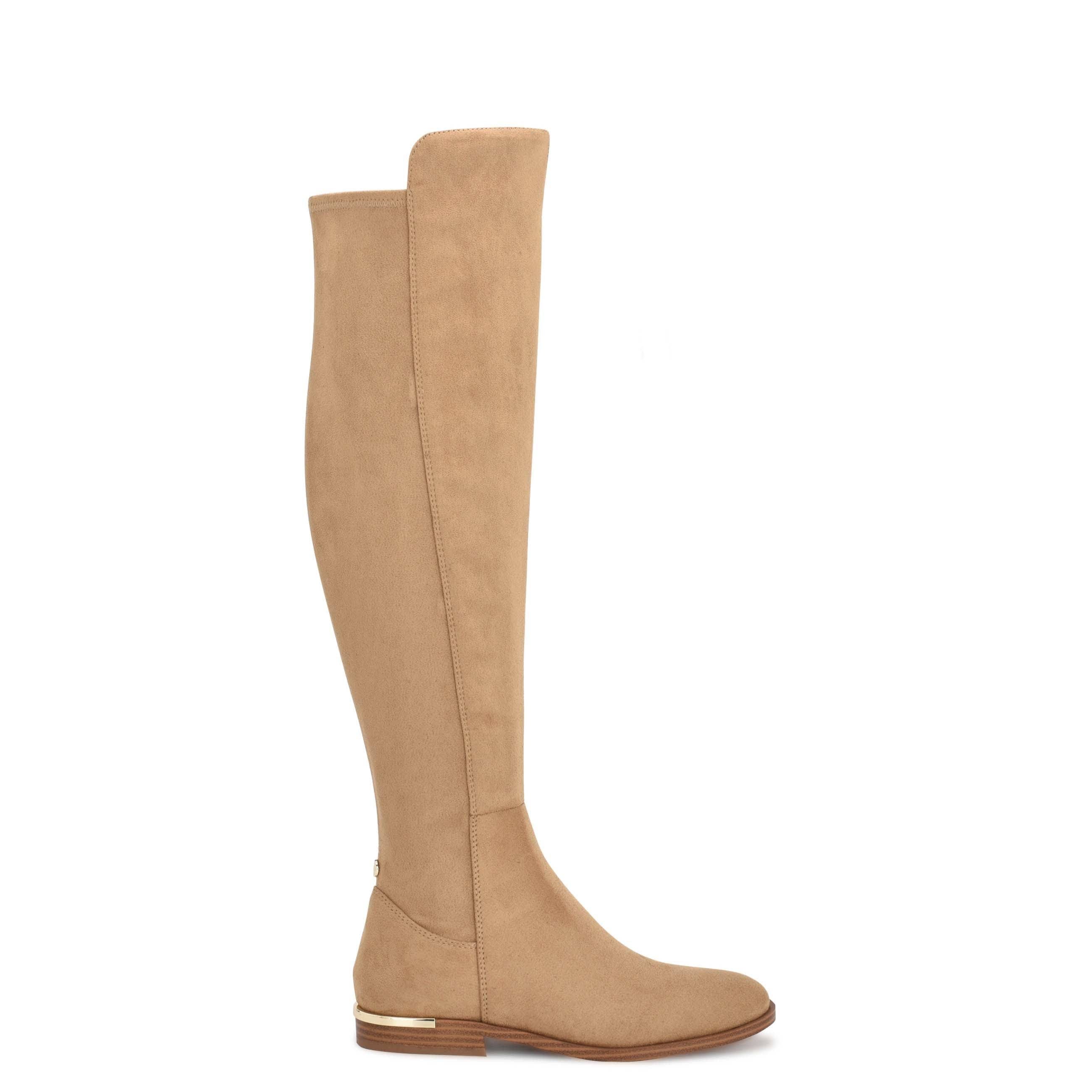Elevated White Knee-High Boots by Nine West | Image
