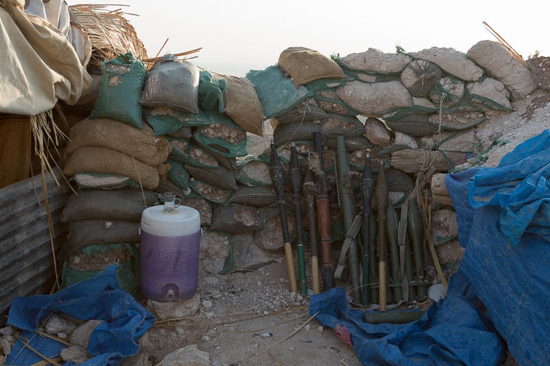 01/09/2015. Bashiqa, Iraq. Ready for use rocket propelled grenades lean against a sandbag wall at a Kurdish peshmerga defensive position on Bashiqa Mountain near Mosul, Iraq. Bashiqa Mountain, towering over the town of the same name, is now a heavily fortified front line. Kurdish peshmerga, having withdrawn to the mountain after the August 2014 ISIS offensive, now watch over Islamic State held territory from their sandbagged high-ground positions. Regular exchanges of fire take place between the Kurds and the Islamic militants with the occupied Iraqi city of Mosul forming the backdrop. The town of Bashiqa, a formerly mixed town that had a population of Yazidi, Kurd, Arab and Shabak, now lies empty apart from insurgents. Along with several other urban sprawls the town forms one of the gateways to Iraq's second largest city that will need to be dealt with should the Kurds be called to advance on Mosul.