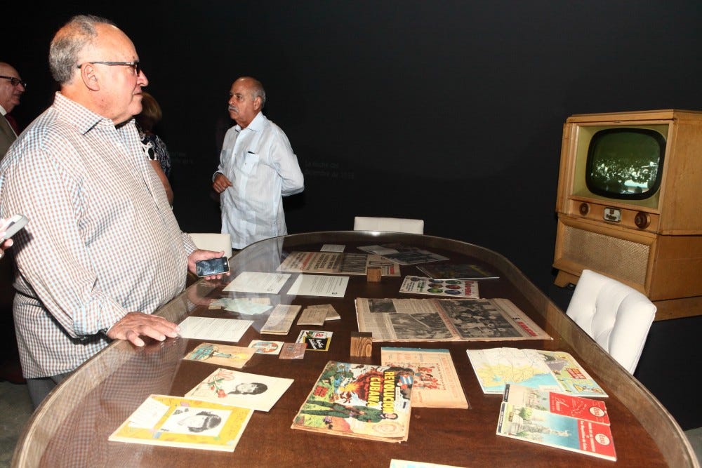 Table with encased Cuban memorabilia.