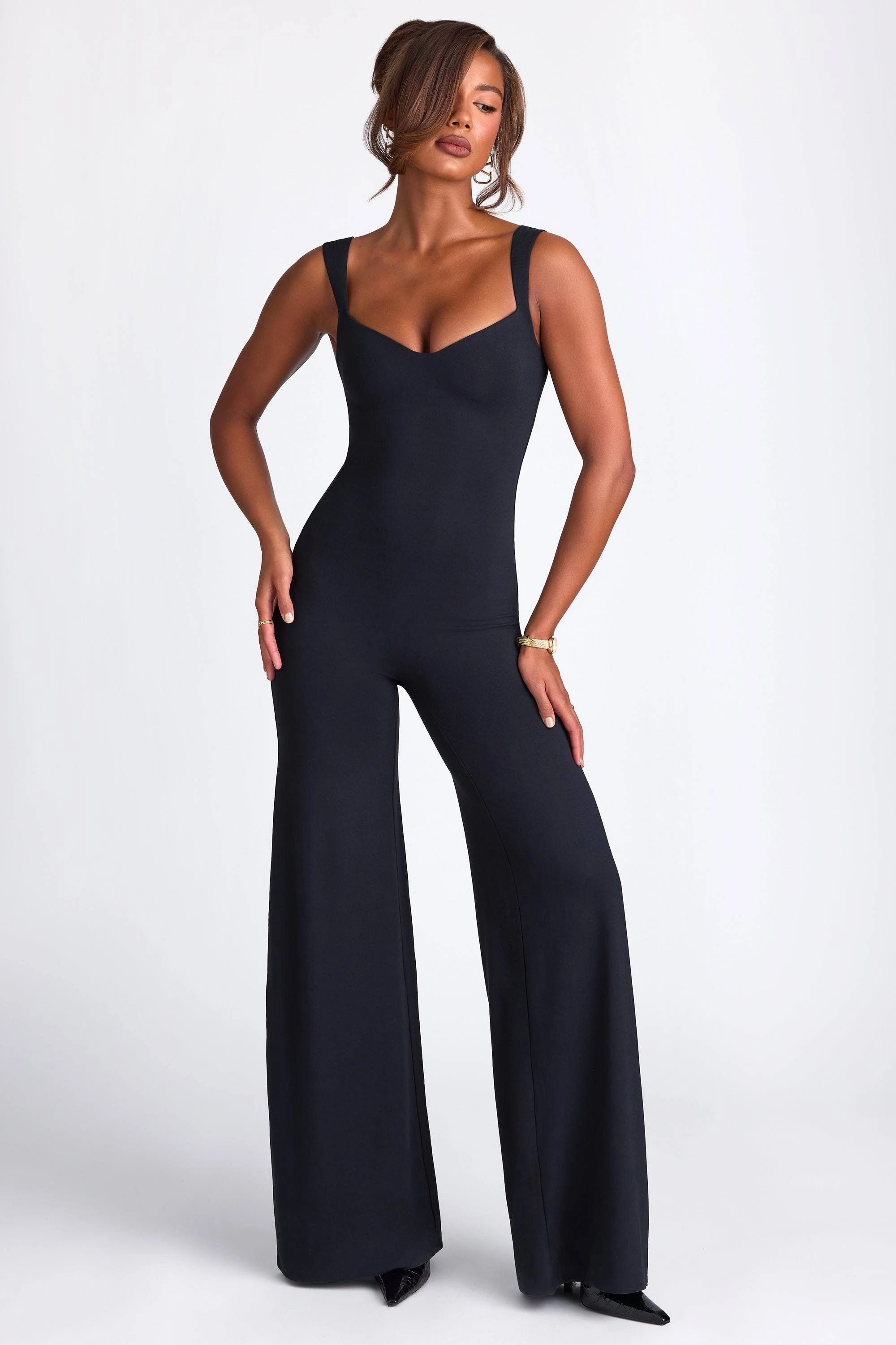 Sustainable Black Jumpsuit with Sweetheart Neckline and Adjustable Straps | Image
