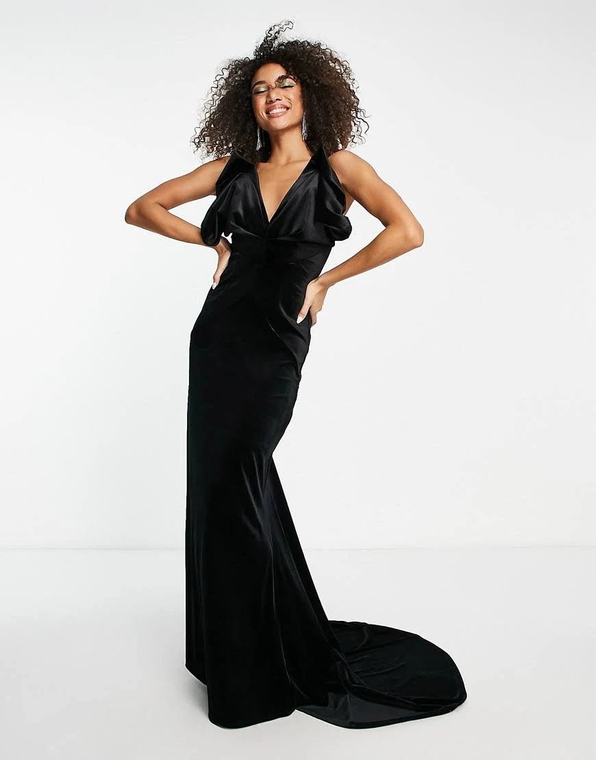 V-neck velvet maxi dress with train detail in black and contrasting accents | Image