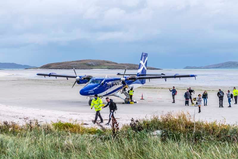 touch down and disembark onto the beach