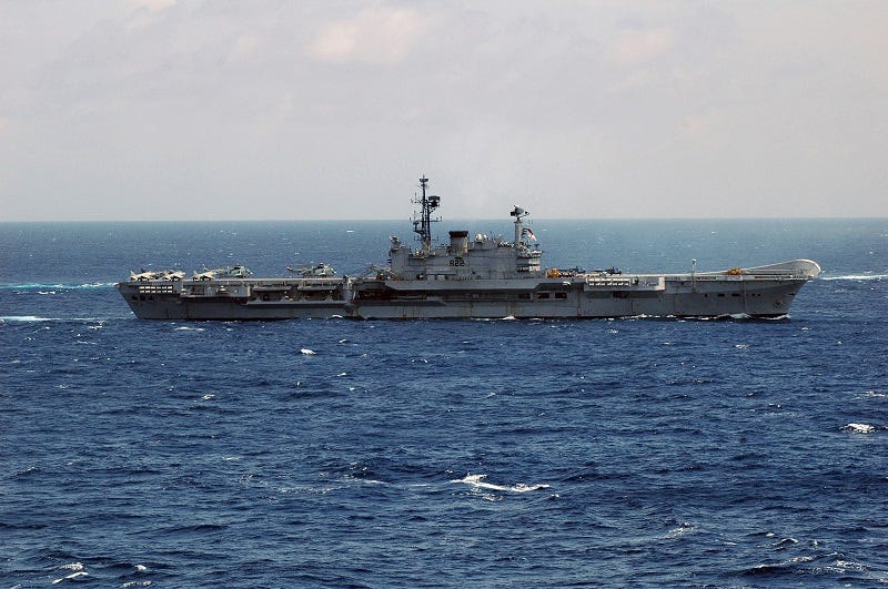 Indian Navy aircraft carrier INS Viraat (R 22) breaks formation during Malabar 2007, an exercise involving Kitty Hawk and Nimitz Carrier Strike Group and ships of the navies of Australia, India, Japan, and the Republic of Singapore. Malabar 2007 is designed to increase interoperability among the navies and to develop common procedures for maritime security operations.