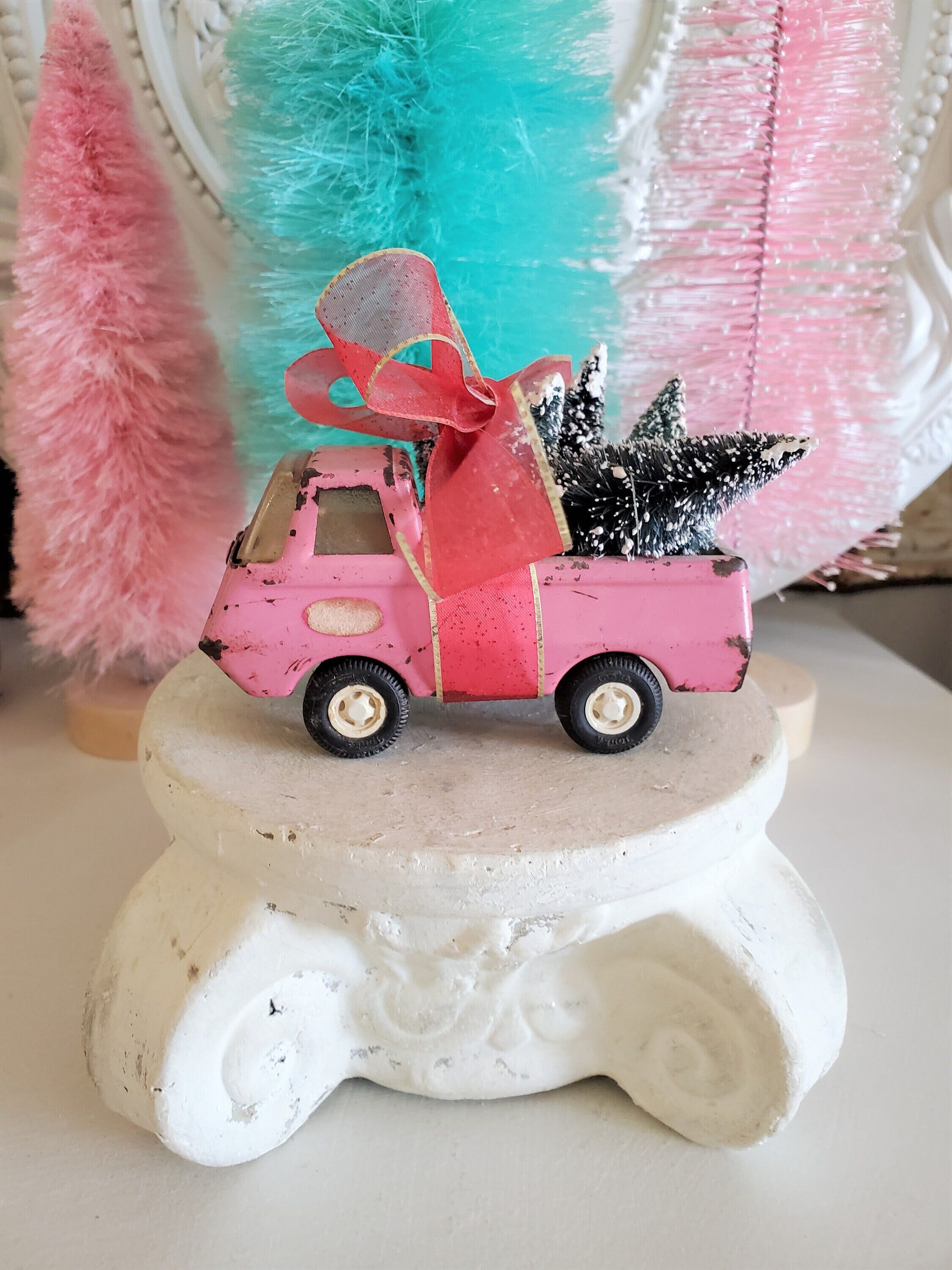 vintage pink tonka Truck filled with trees, Christmas truck, bottle brush trees