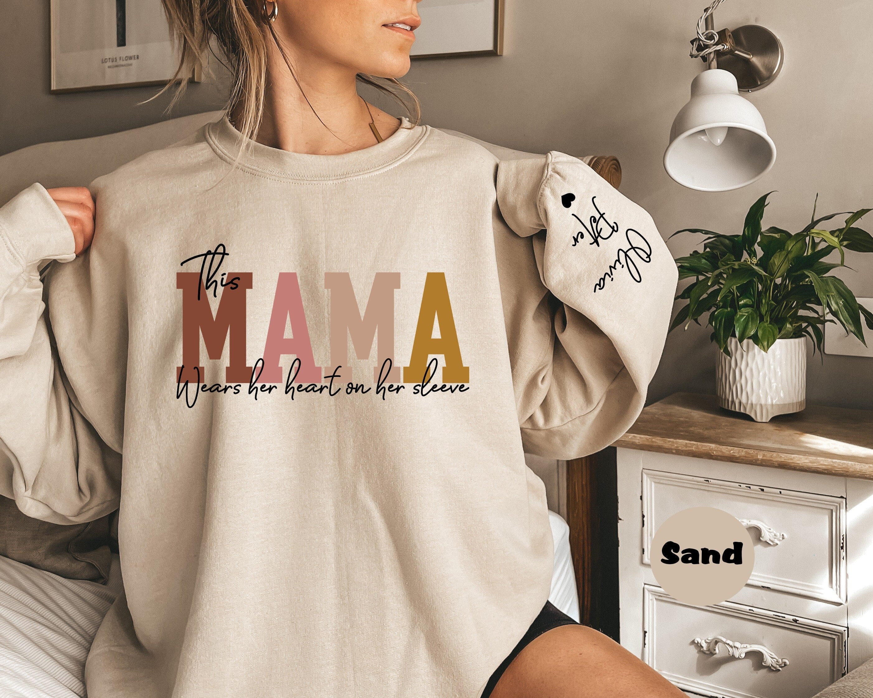 Custom This Mama Wears Her Heart On Her Sleeve Hoodie, Personalized Mom Sweatshirt With Kids Names, Cute Momma Outfit, Mothers Day Gifts