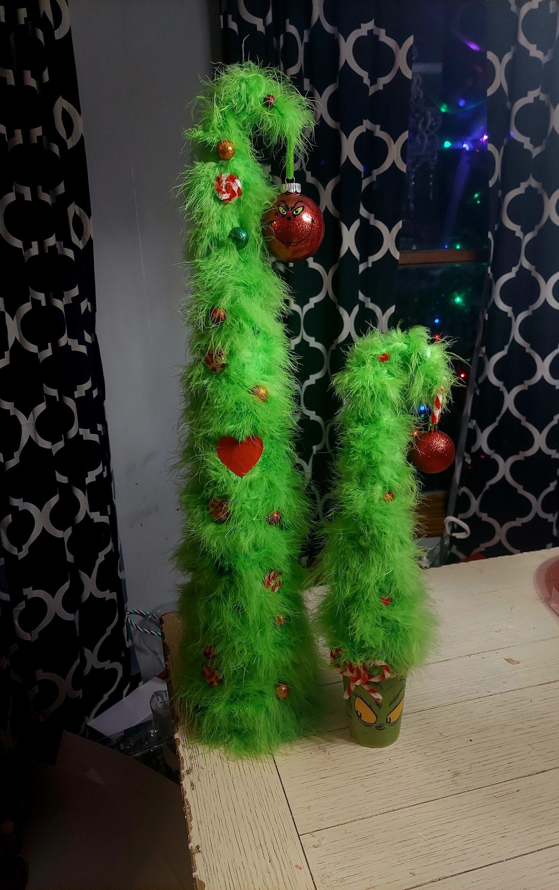 Adorable furry 18 inch Grinch themed bent christmas tree in a Grinch face Cup. Too cute