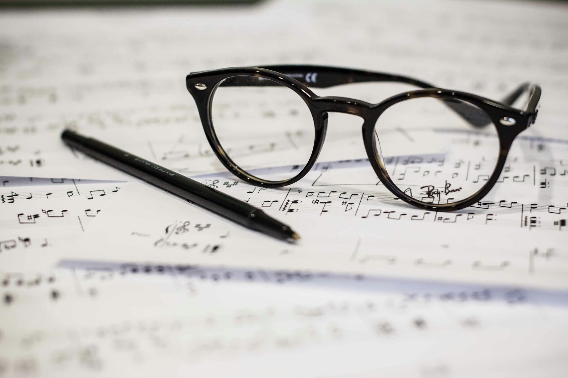 glasses on classical music notes